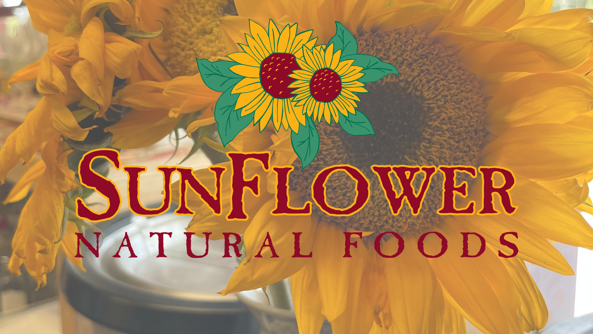 Sunflower Natural Foods Icon on top of a photo of sunflowers